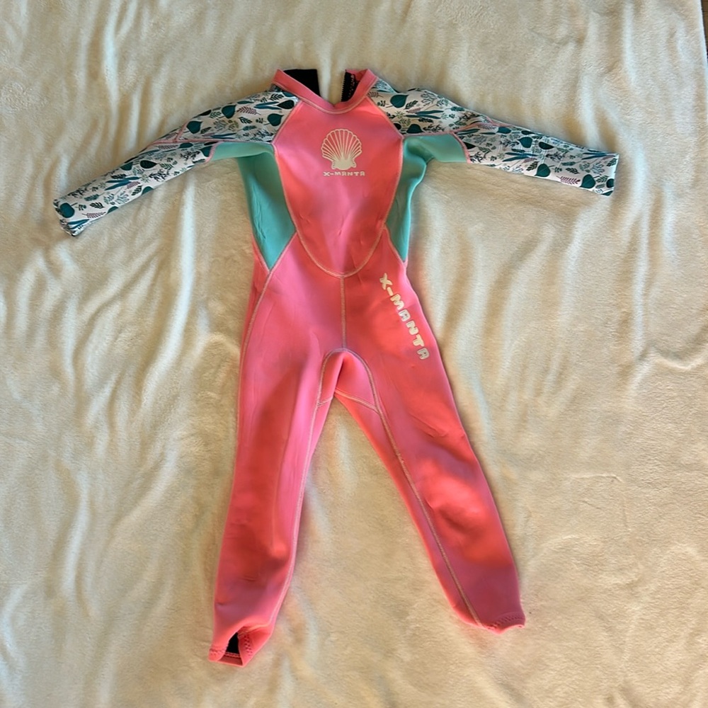 Hot pink X-Mantra wetsuit. Kids size Large.